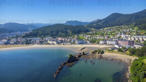 Aerial view of covas beach meeting the charming town of viveiro, nestled amidst the stunning