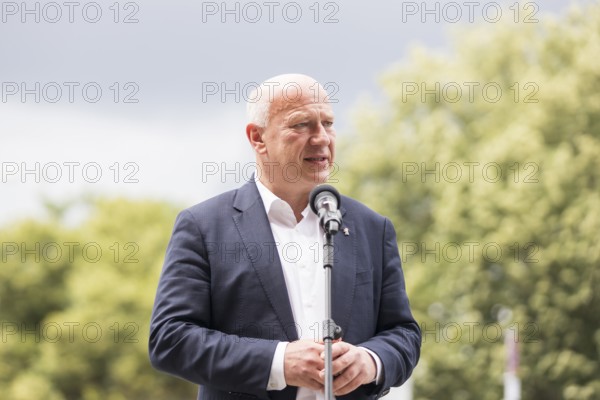 Kai Wegner (Governing Mayor of Berlin) gives a speech in front of the raising of the rainbow flag