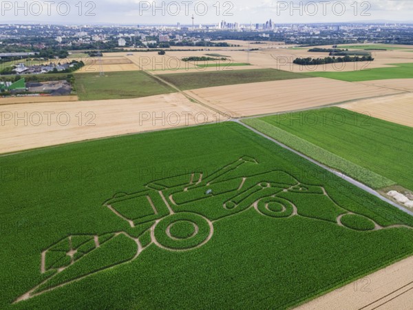 The maize maze of the Maize Spirits near Weißkirchen, near Frankfurt am Main, shows a combine