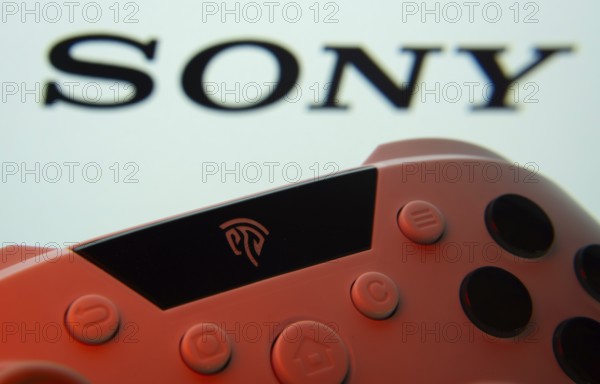 Dhaka, Bangladesh- 02 July 2025: A close-up of a gamepad with the sony seen on screen in the