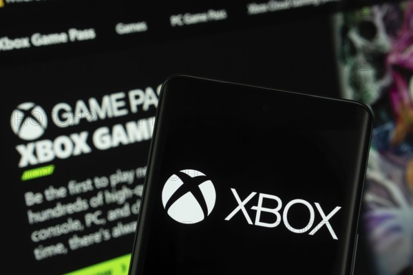 Dhaka, Bangladesh- 04 July 2025: Xbox logo is displayed on a smartphone screen, with the website