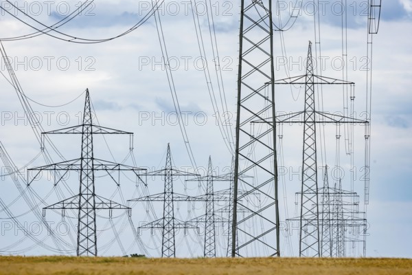 Many high-voltage power lines and lattice towers in the district of Ludwigsburg near Besigheim,