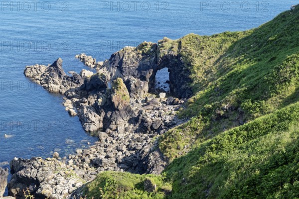 Rocky coast and rock gate on the south-east coast near the southern tip of Cornwall on the English