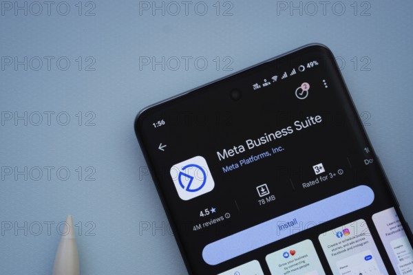 Dhaka, Bangladesh- 29 May 2025: On a blue surface, a smartphone displays the Meta Business Suite