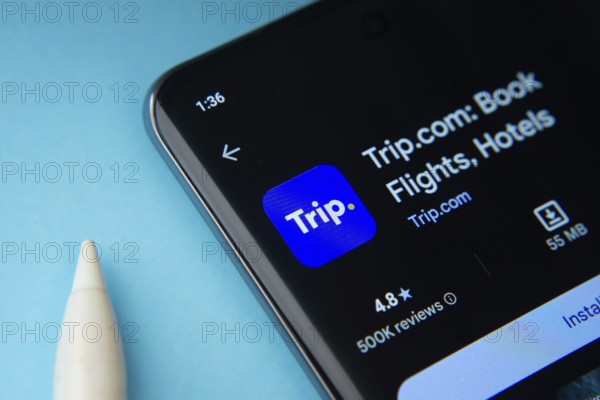 The trip.com app from Google Playstore is displayed on a smartphone screen