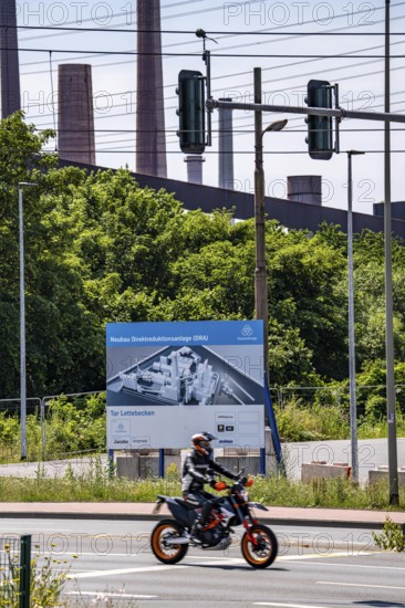 Construction site sign for thyssenkrupp Steel's first direct reduction plant, the climate-neutral
