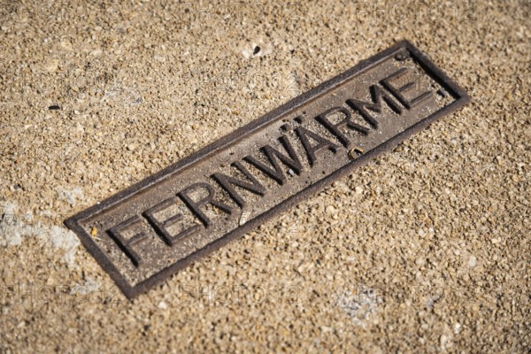 Sign for district heating on a manhole cover in Wuppertal, Germany