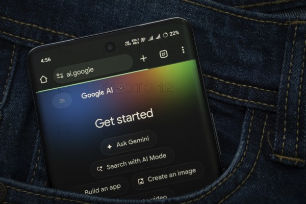 Dhaka, Bangladesh- 15 June 2025: A smartphone displaying the Google AI web interface peeks out of a
