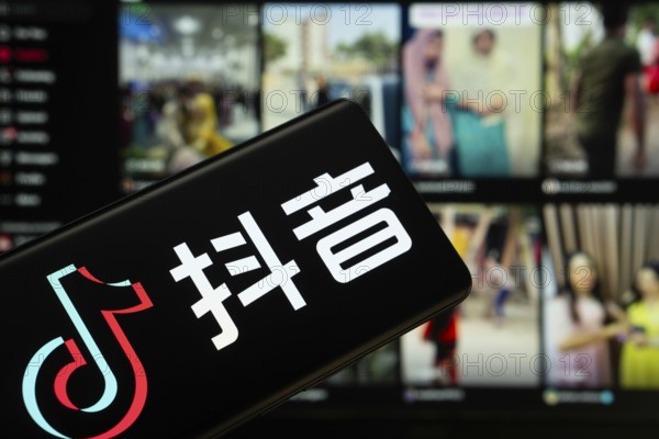 Dhaka, Bangladesh - 18 March 2025: The logo of the tiktok is displayed on a smartphone screen, and