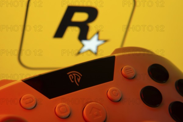 Dhaka, Bangladesh- 12 June 2025: A close-up of a gamepad with the rockstar games seen on screen in