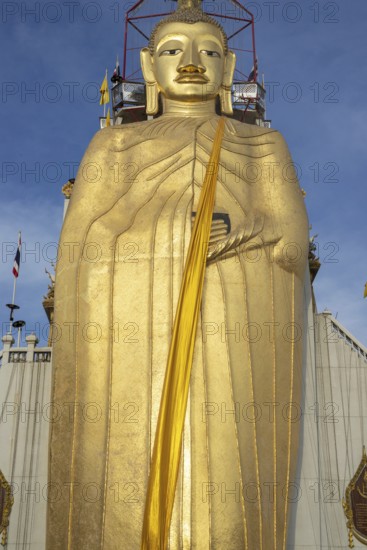 32 metre high standing Buddha decorated with glass mosaics and 24 carat gold, the upper knot of the