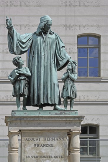 Monument to theologian, pedagogue and poet, August Hermann Francke, man with two children, protect,