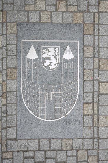 City coat of arms on the ground with paving stones, market square, Weißenfels, Saxony-Anhalt,