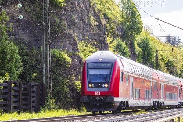 Regional express RE5 en route on the winding railway line of the Geislinger Steige. Landscape along