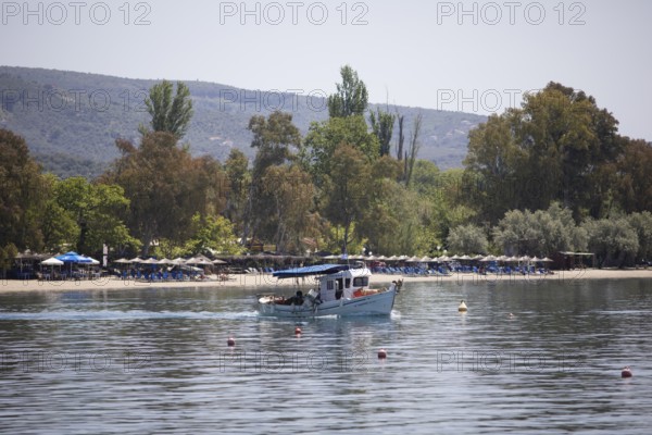 Fishing boat in the Pagasitic Gulf, behind the beach of Kala Nera, Pelion or Pelion Peninsula,
