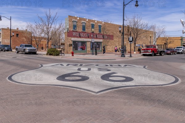 Tourists take photos Standin' on a Corner in Winslow Arizona as sung in the classic Glenn Frey and