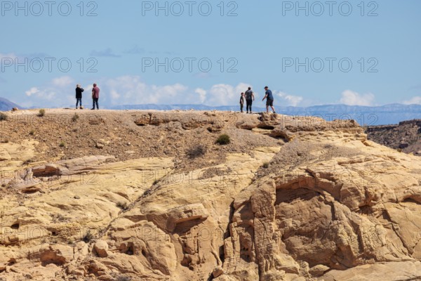 Hikers on the trail to an overlook at the end of Fire Canyon Road at Valley of Fire State Park near