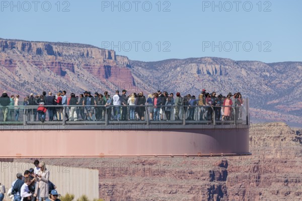 Visitors view the Grand Canyon from the Skybridge, a glass floored bridge extending 70 feet over