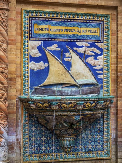 Botanic garden at the plaza espana, fountain with decoration showing sailing ship, Seville,