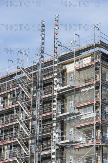 Symbolic image, residential construction, new building, corner building with extensive scaffolding,