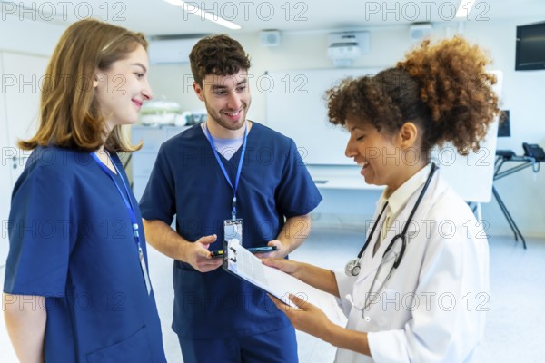 Doctors and nurses collaborating, analyzing medical records and discussing patient treatment in a