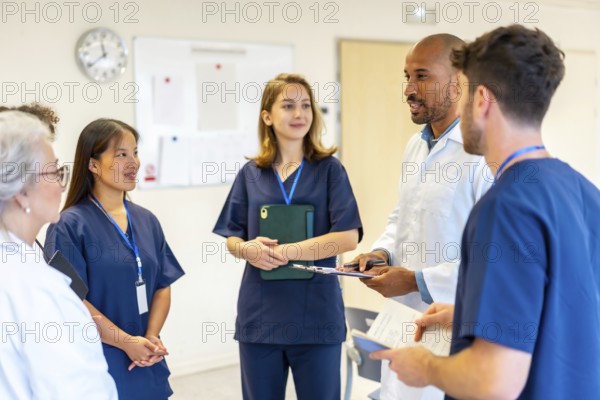 Diverse medical professionals collaborating, sharing expertise, and reviewing patient information