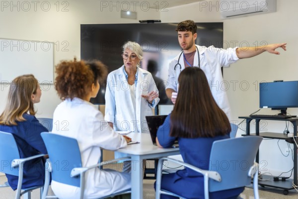 Doctors and nurses having a meeting in a hospital conference room, discussing patient cases and