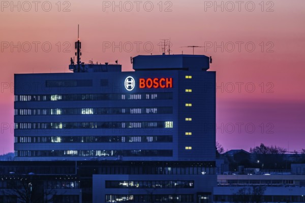 Bosch factory at sunset. Illuminated logo of the company. Schwieberdingen, Baden-Württemberg,