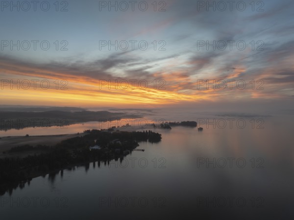 Aerial view of the Mettnau peninsula near Radolfzell on Lake Constance in front of sunrise, on the