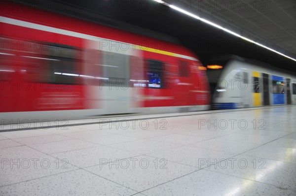 Underground arriving S-Bahn, train, class 420 in traffic red, coupled with Generation 2025,