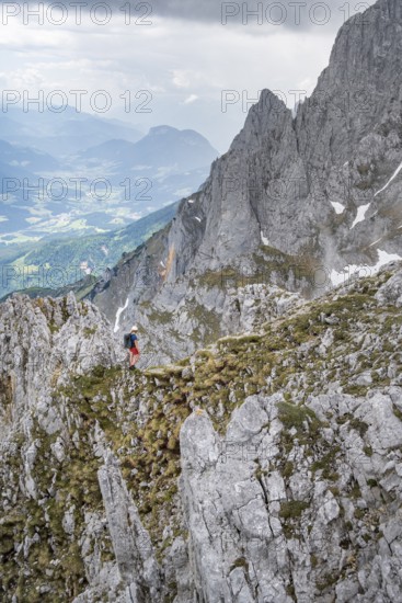Mountaineer with helmet, ascent to the Ackerlspitze, Wilder Kaiser, Kaiser Mountains, Tyrol,