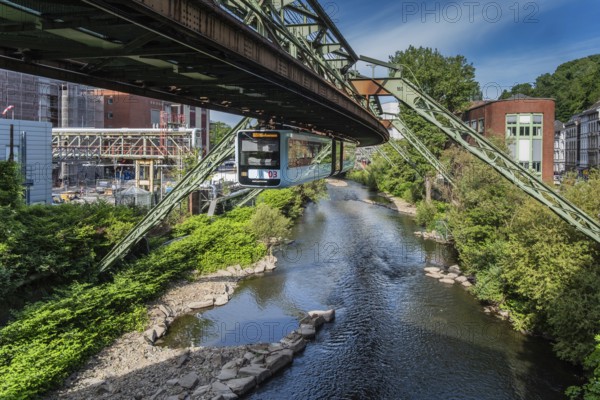 The Wuppertal suspension railway runs through a historic district and industrial area near the