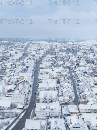 Small settlement under snow cover with straight main road, Deckenpfronn, Böblingen district,