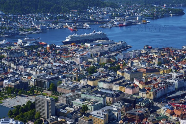 Panoramic view of a coastal town with harbour and a variety of buildings, Fløibanen mountain