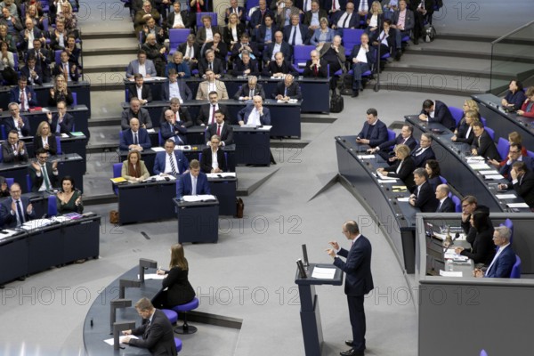Friedrich Merz (CDU) speaks in the direction of the AfD parliamentary group during a Bundestag