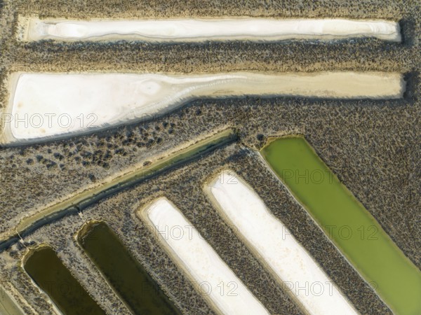 Saline ponds at the salt works near Chiclana de la Frontera. Aerial view. Drone shot. Cádiz