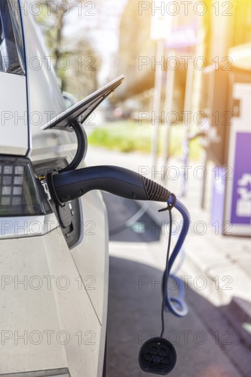 Charging the battery of an electric car with electricity E-car at an electric petrol station petrol