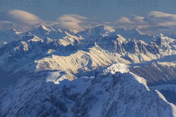 Mountain peak in the evening light with foehn clouds, winter, view from Zugspitze to Stubai Alps,