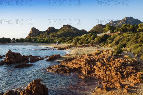 Lonely picturesque beach and red rocks, Spiaggia Su Sirboni, sunrise, near Tertenia, Province of