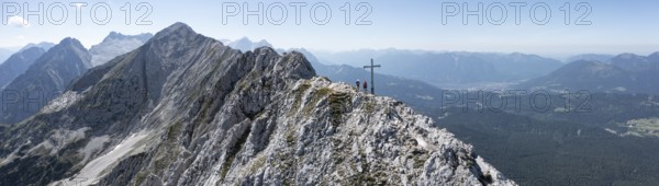 Aerial view, Alpine panorama, hikers at the summit cross, Westliche Wettersteinspitze, Wetterstein