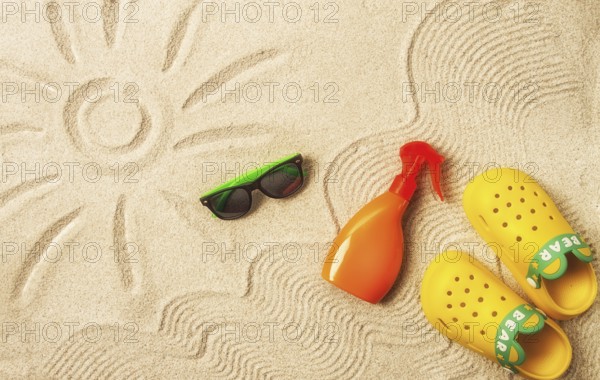 Drawing on the sand, sun and waves, sunglasses, with an orange bottle, yellow rubber slippers, sun