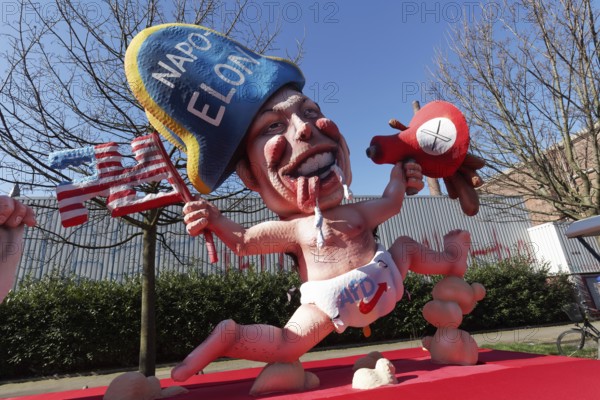 Elon Musk with Napoleon hat, wearing nappy trousers with AfD logo, papier-mâché figure, themed