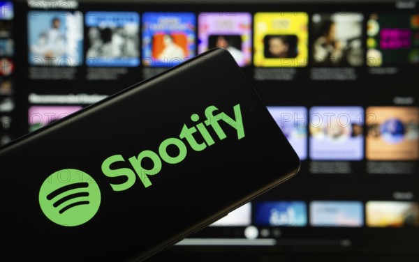 Dhaka, Bangladesh - 18 March 2025: The logo of the spotify is displayed on a smartphone screen, and