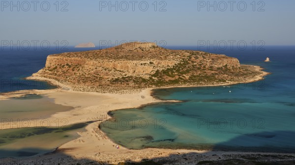 Tigani Island, Pontikos Island, morning light, lagoon, sandbank, parasols, tourists on the beach,