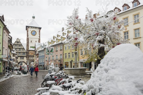 Houses covered with snow in the historic city centre, Freiburg im Breisgau, Black Forest,
