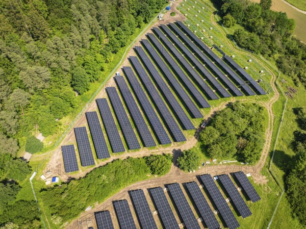 Aerial view of solar panels on an area at the edge of a forest, construction of the Black Forest