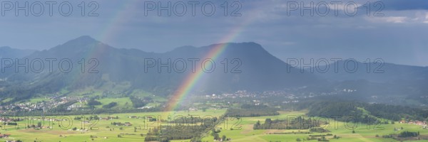 Panorama from the Grünten over the Illertal with rainbow to Blaichach and Immenstadt, behind