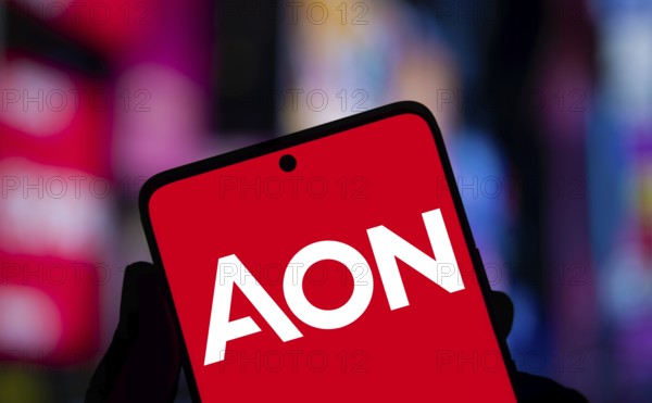 Aon logo is displayed on smartphone. Aon plc is a British-American professional services.