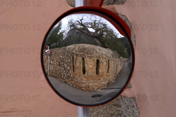 Reflection of a wall in a wide-angle mirror, traffic mirror 180 degrees, Alaró, Calvià, Majorca,