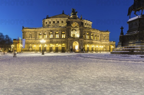 Illuminated Semper Opera House and Theatre Square with snow at dusk, Old Town of Dresden, Saxony,